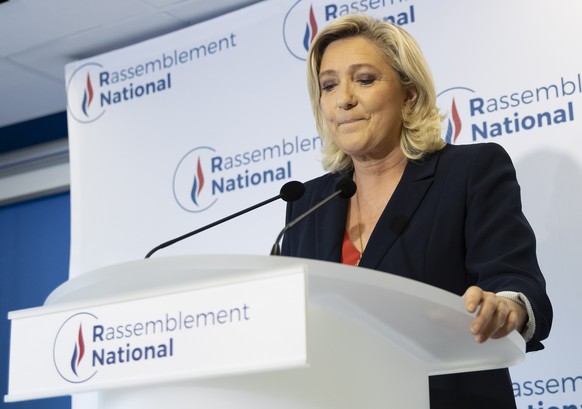 epa09306534 Far-right Rassemblement National (RN) party president Marine Le Pen delivers a statement at the party headquarters in Nanterrre near Paris, France, 27 June 2021. Polls closed after a secon ...