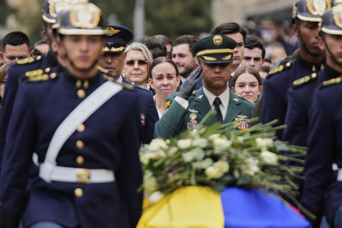 CORRECTS TARAZONA'S MIDDLE NAME - Maria Claudia Tarazona, wife of presidential hopeful and opposition Sen. Miguel Uribe, who died from wounds suffered when he was shot at a political rally, walks ...