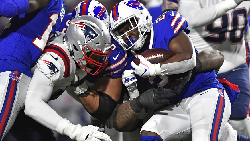 Buffalo Bills running back Devin Singletary (26) carries the ball during the first half of an NFL football game against the New England Patriots in Orchard Park, N.Y., Monday, Dec. 6, 2021. (AP Photo/ ...