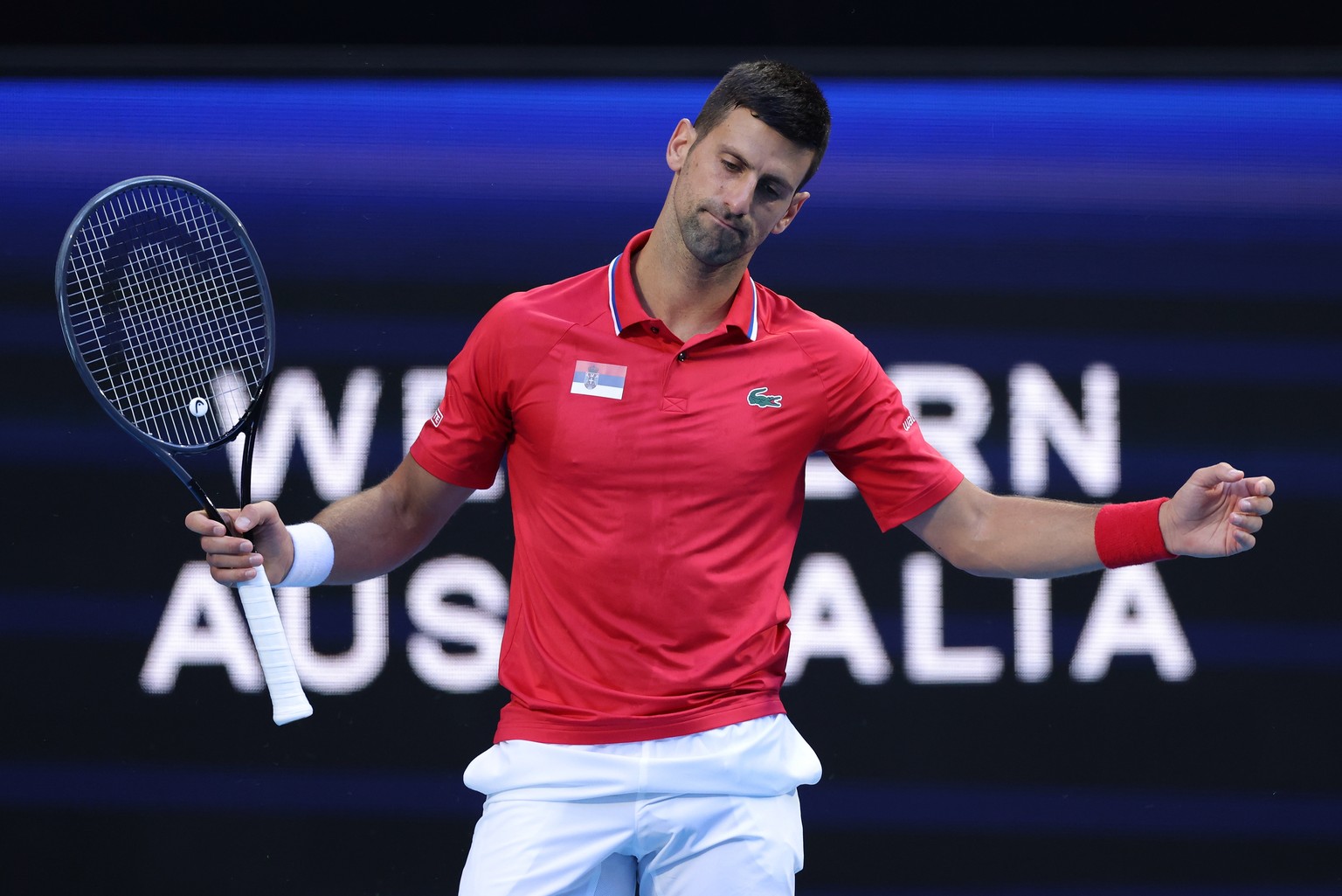 epa11054632 Novak Djokovic of Serbia reacts during his match against Alex De Minaur of Australia during their quarterfinal match of the 2024 United Cup at RAC Arena in Perth, Australia, 03 January 202 ...