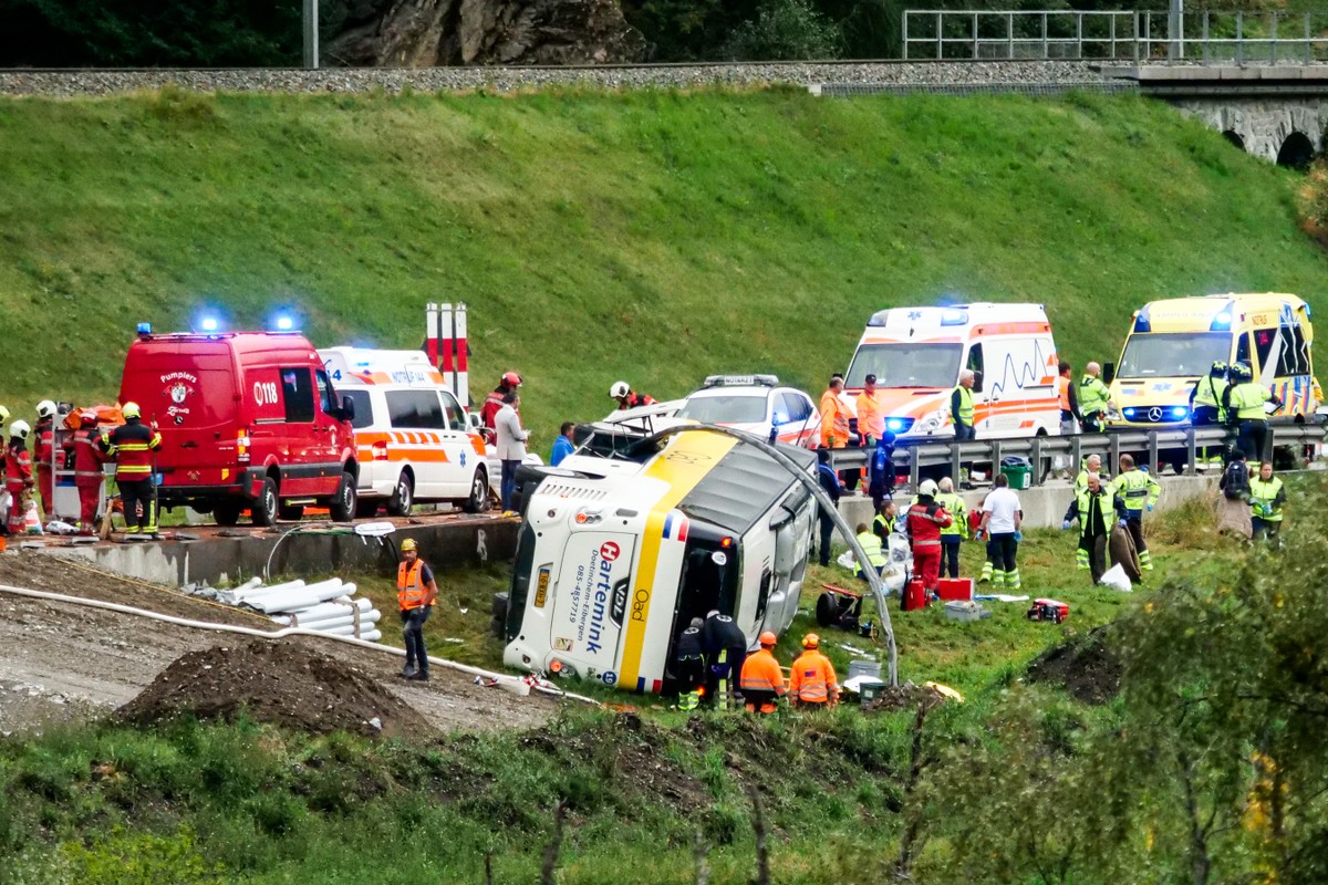 Emergency responders at the scene of an accident involving a travel coach in Susch in the canton of Grisons, Switzerland, on Thursday, September 10, 2026. Several people died in a tour bus accident on ...