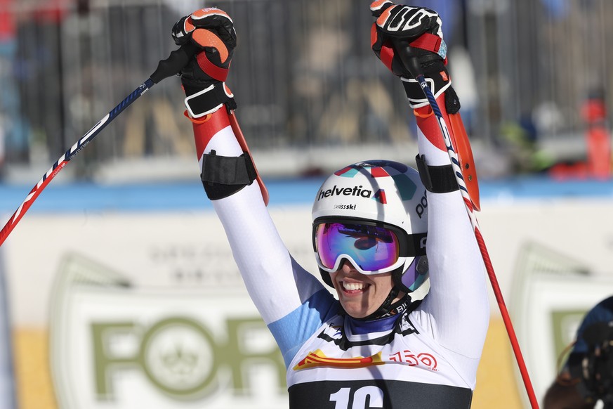 Switzerland&#039;s Michelle Gisin celebrates after crossing the finish line of an alpine ski, women&#039;s World Cup super-G race in Cortina d&#039;Ampezzo, Italy, Sunday, Jan. 23, 2022. (AP Photo/Ale ...