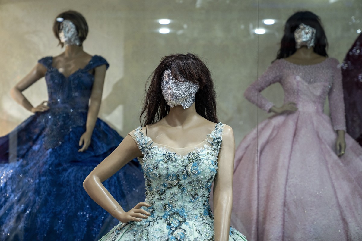 Mannequin's heads are covered in a women's dress store store in Kabul, Afghanistan, Sunday, Dec. 25, 2022. Under the Taliban, the mannequins in women's dress shops across the Afghan cap ...