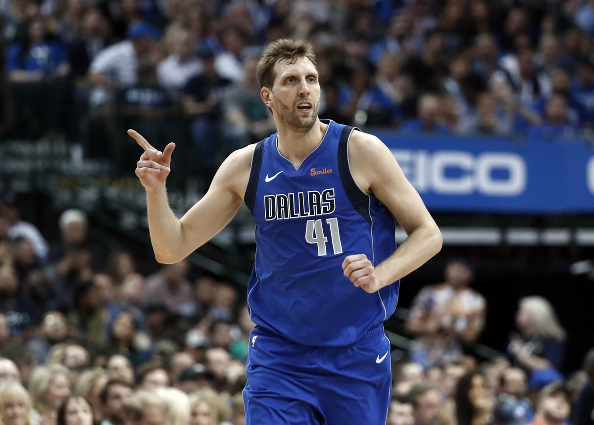 Dallas Mavericks' Dirk Nowitzki (41) celebrates a basket against the Phoenix Suns during the first half of an NBA basketball game in Dallas, Tuesday, April 9, 2019. (AP Photo/Tony Gutierrez)