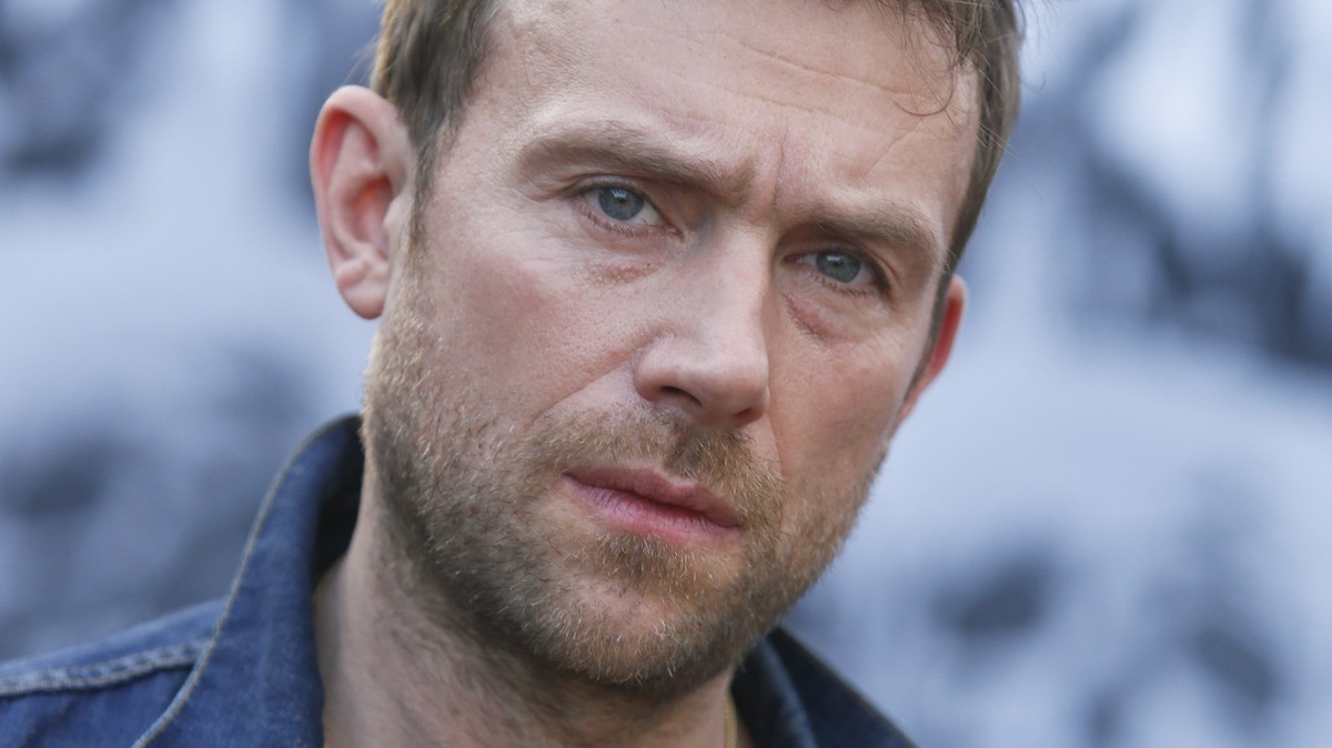 FILE - In this March 14, 2014 file photo, Damon Albarn poses for a photograph during the SXSW Music Festival, in Austin, Texas. Albarn's new album, "Everyday Robots," released on Monday ...
