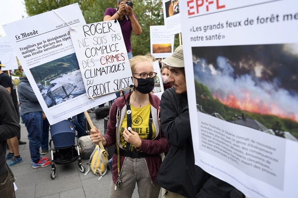 epa08693004 Climate activists demonstrate after the verdict of guilty in the trial against 12 climate activists of the LAC collective (Lausanne Action Climate), who were prosecuted on appeal for organ ...
