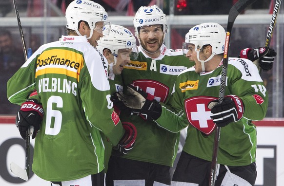 Switzerland&#039;s Timo Helbling, Patrick Geering, Matthias Bieber and Chris Baltisberger, from left, celebrate after scoring the 3-1 goal, during the Swiss Ice Hockey Challenge 2016 between Switzerla ...