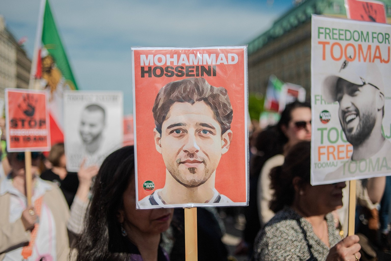 Toomaj Salehi Demonstration Berlin Protesters hold signs during a rally protesting against a death sentence given to Toomaj Salehi, a famous Iranian rapper, after Iranian courts accused him of singing ...