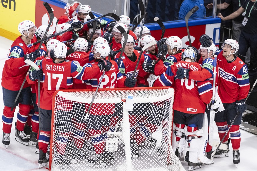 Norway's players celebrate thir victory after the 2026 IIHF Men's Ice Hockey World Championship preliminary round group B game between Norway and Sweden, at the BCF Arena ice hockey stadium, ...