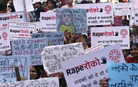 epa06666310 Indian activists hold placards to show support for the chairperson of the Delhi Commission for Women Swati Maliwal, who is on a hunger strike against the alleged rapes in Uttar Pradesh, Ja ...