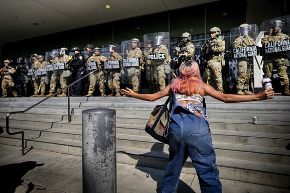A protester taunts a line of California National Guard protecting a federal building in downtown Los Angeles on Monday, June 9, 2025. (AP Photo/Eric Thayer)
APTOPIX Immigration Raids Los Angeles