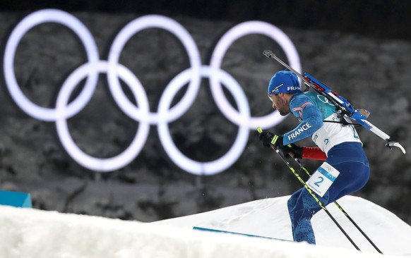 epa06539578 Gold medalist Martin Fourcade of France in action during the Men&#039;s Biathlon 15 km Mass Start race at the Alpensia Biathlon Centre during the PyeongChang 2018 Olympic Games, South Kore ...