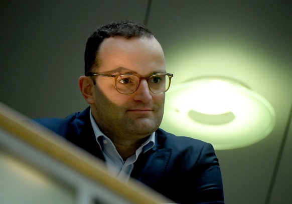 epa07129182 German Health Minister Jens Spahn watches a press conference of German Chancellor Angela Merkel (not in picture) after the board meeting of Christian Democratic Union (CDU) party in Berlin ...