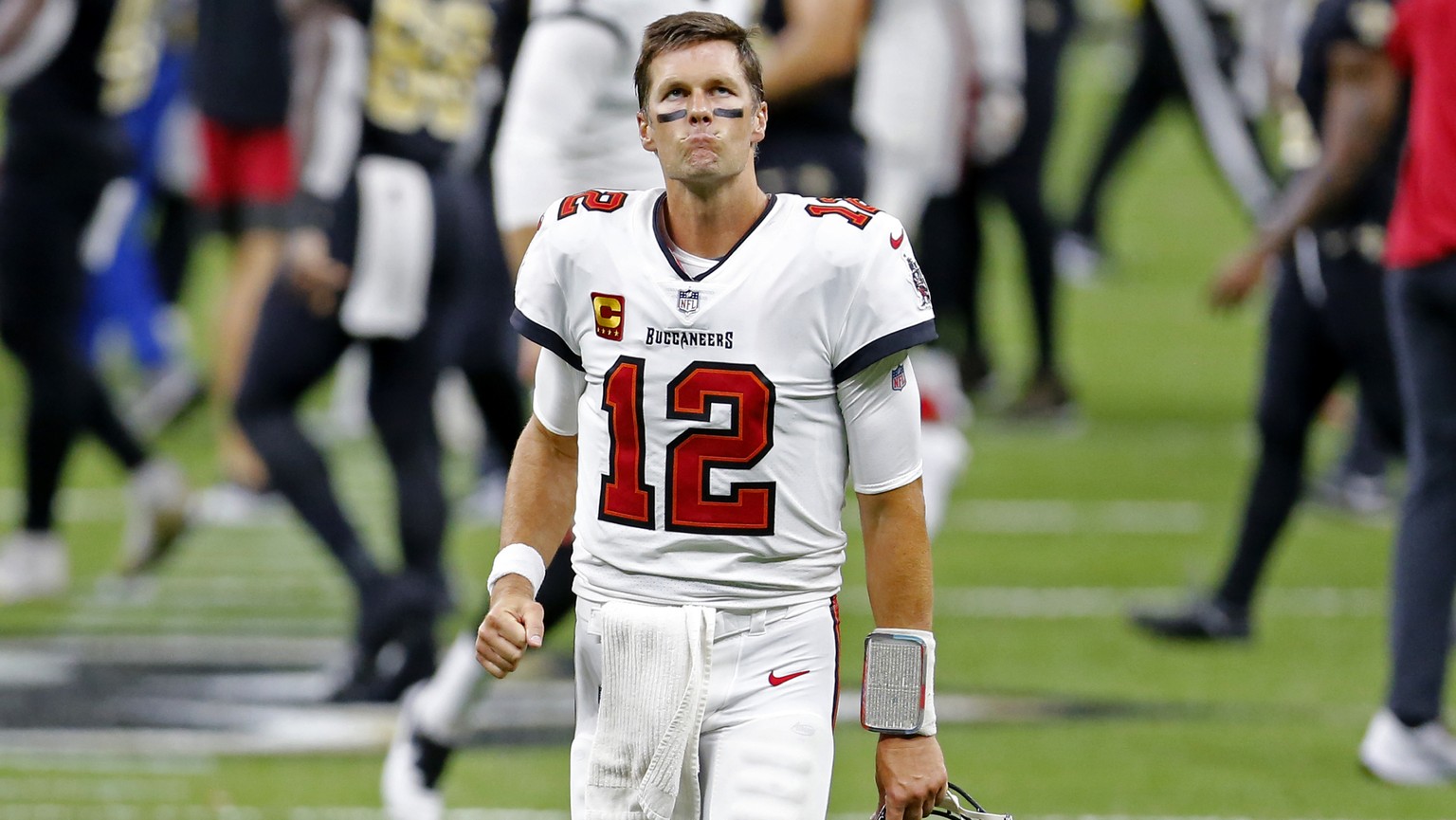 Tampa Bay Buccaneers quarterback Tom Brady (12) reacts after an NFL football game against the New Orleans Saints in New Orleans, Sunday, Sept. 13, 2020. The Saints won 34-23. (AP Photo/Brett Duke)