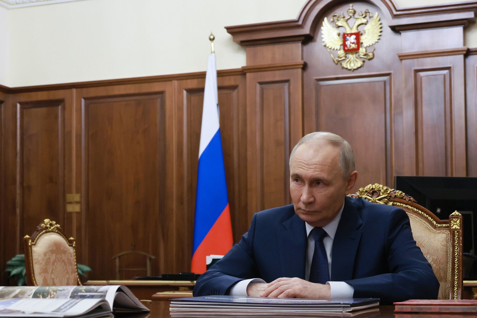 Russian President Vladimir Putin listens to the Head of the Republic of Adygea Murat Kumpilov during their meeting at the Kremlin in Moscow, on Tuesday, Jan. 20, 2026. (Vyacheslav Prokofyev, Sputnik,  ...
