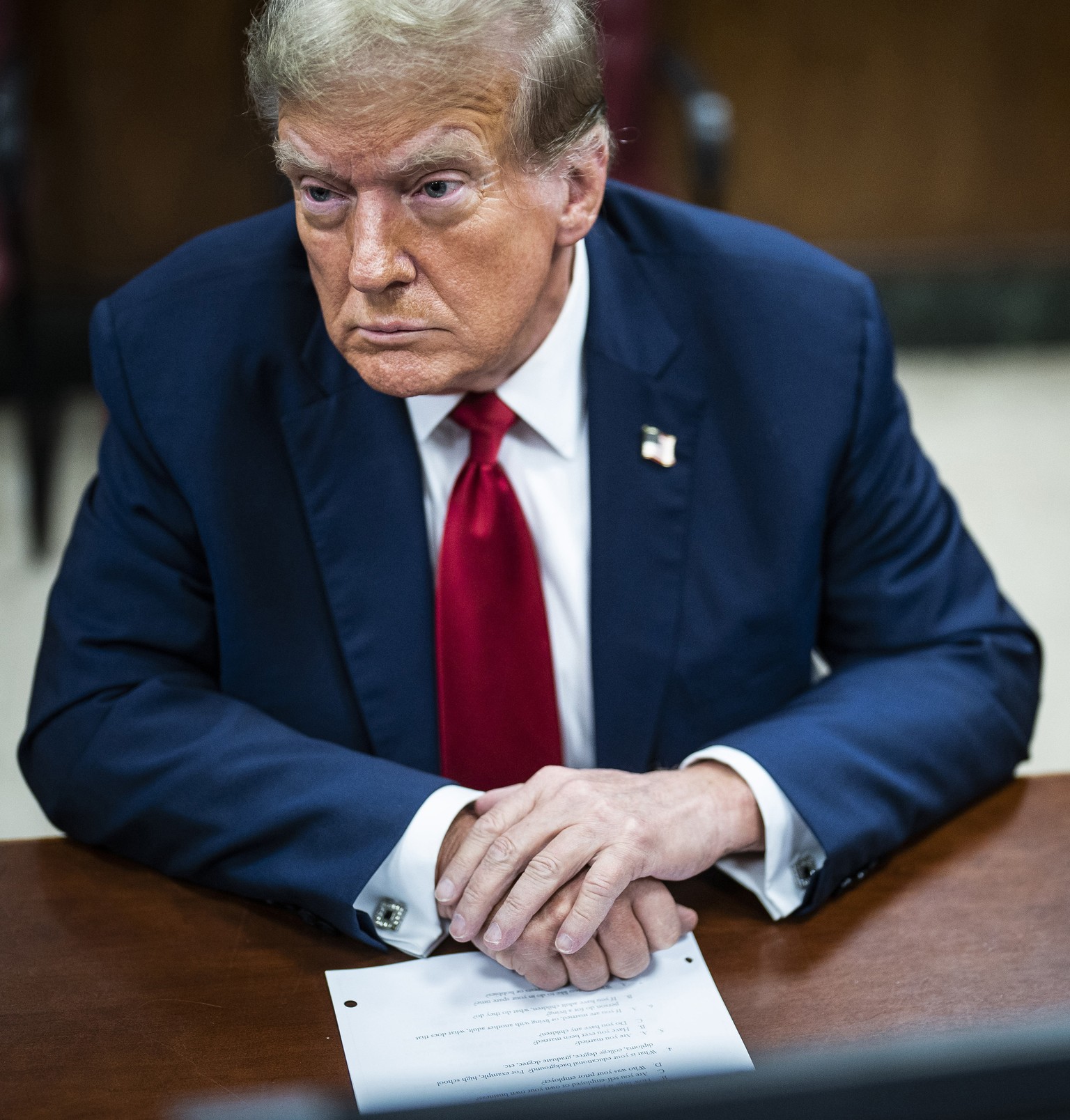 Former President Donald Trump sits inside a Manhattan criminal court with his legal team on the first day of jury selection, in New York, April 15, 2024. (Photo by Jabin Botsford/Washington Post via A ...