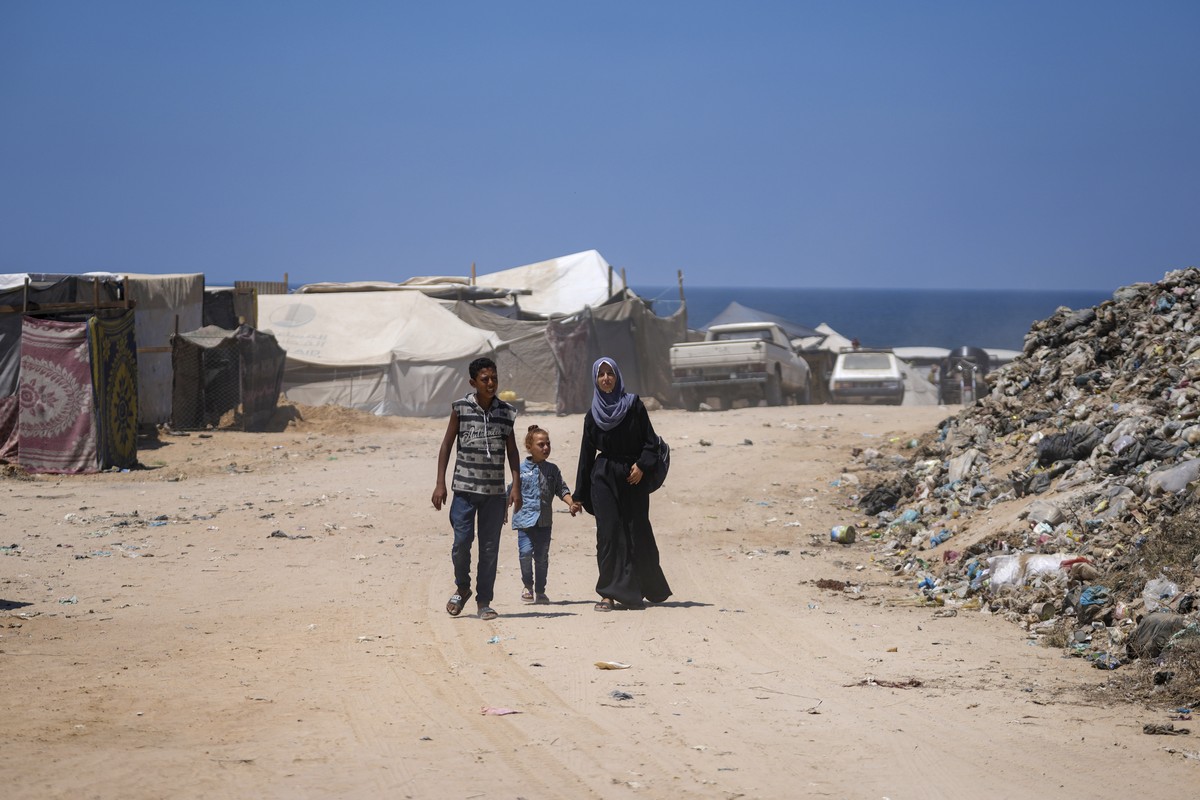 Displaced Palestinians walk past tents pitched on the beach, west of Deir al-Balah, Gaza Strip, Tuesday, Aug. 20, 2024. (AP Photo/Abdel Kareem Hana)
Benjamin Netanyahu