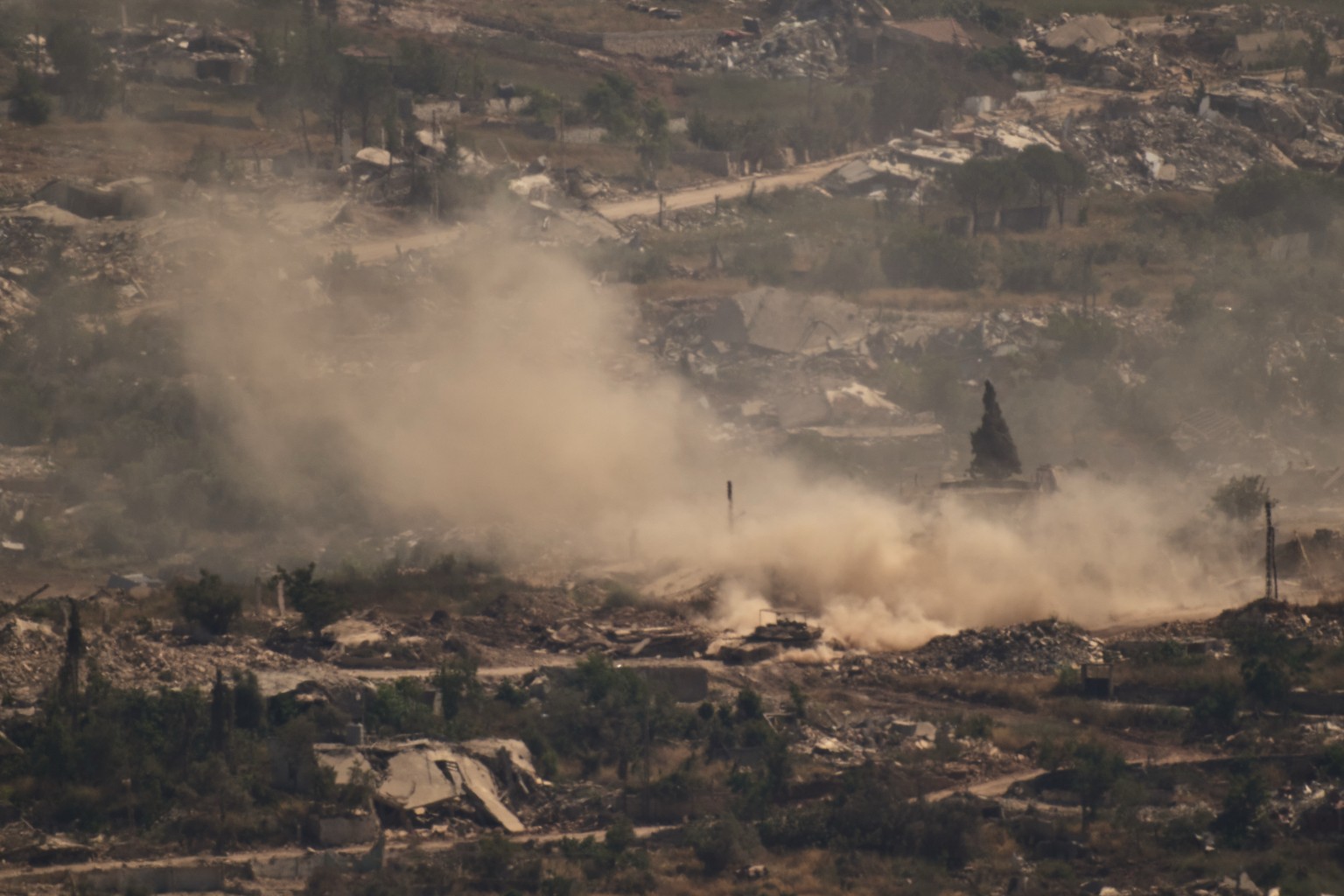 An Israeli tank moves past destroyed buildings in southern Lebanon as seen from northern Israel, Saturday, June 20, 2026. (AP Photo/Leo Correa)
Israel Lebanon Iran War