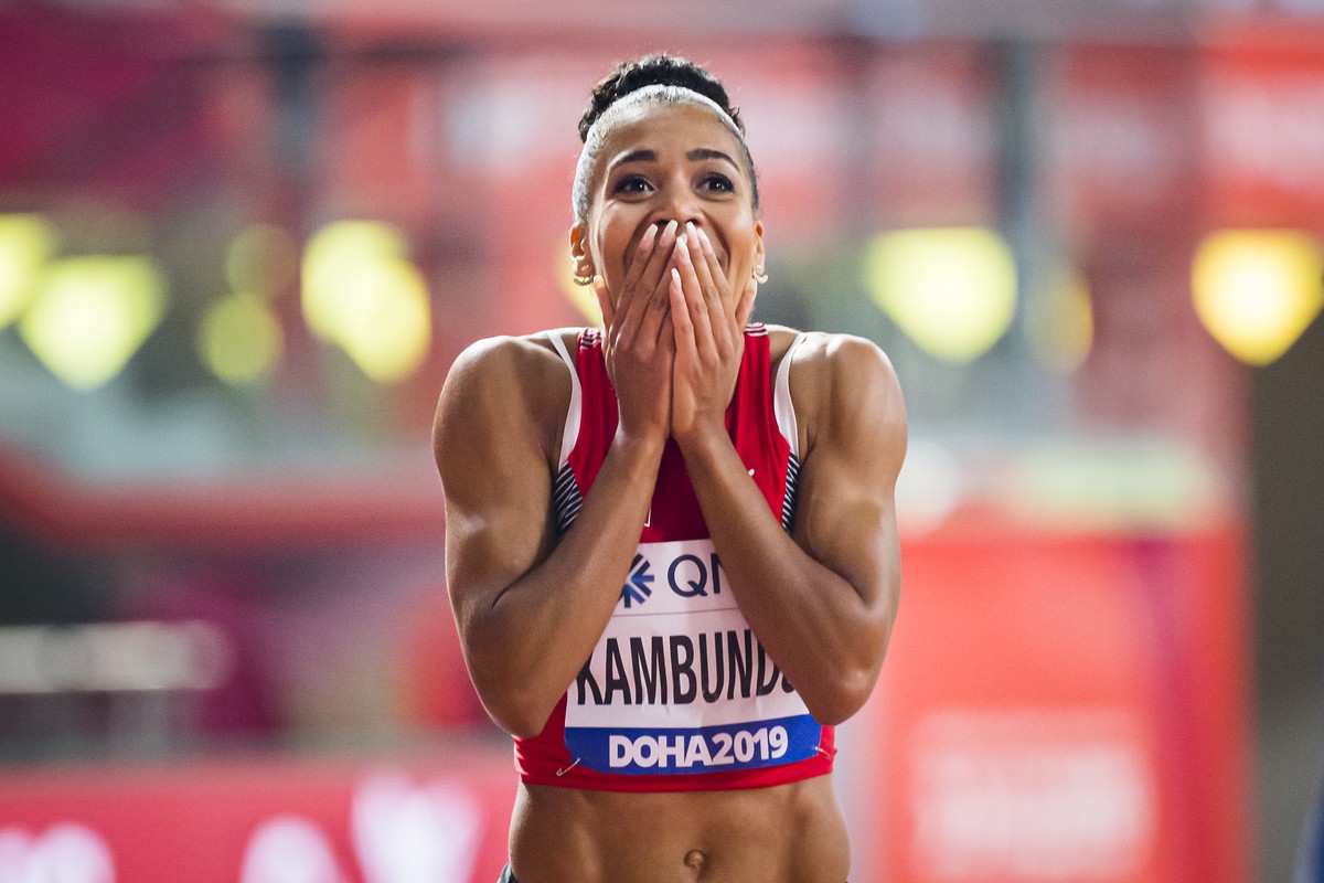 Bronze medal Mujinga Kambundji from Switzerland celebrates during the women's 200 meters final at the IAAF World Athletics Championships, at the Khalifa International Stadium, in Doha, Qatar, Wed ...