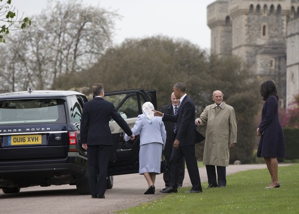 President Barack Obama and first lady Michelle Obama are greeted by Queen Elizabeth II and Prince Philip as they arrive at Windsor Castle in Windsor, England, Friday, April 22, 2016. (AP Photo/Carolyn ...