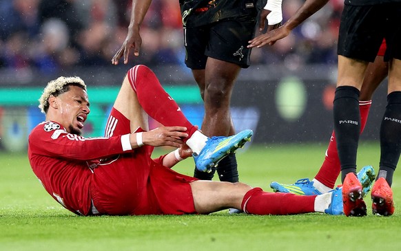 epa12890268 Hugo Ekitike of Liverpool goes down with an injury during the UEFA Champions League quarter-finals, 2nd leg match Liverpool FC against Paris Saint-Germain, in Liverpool, Britain, 14 April  ...