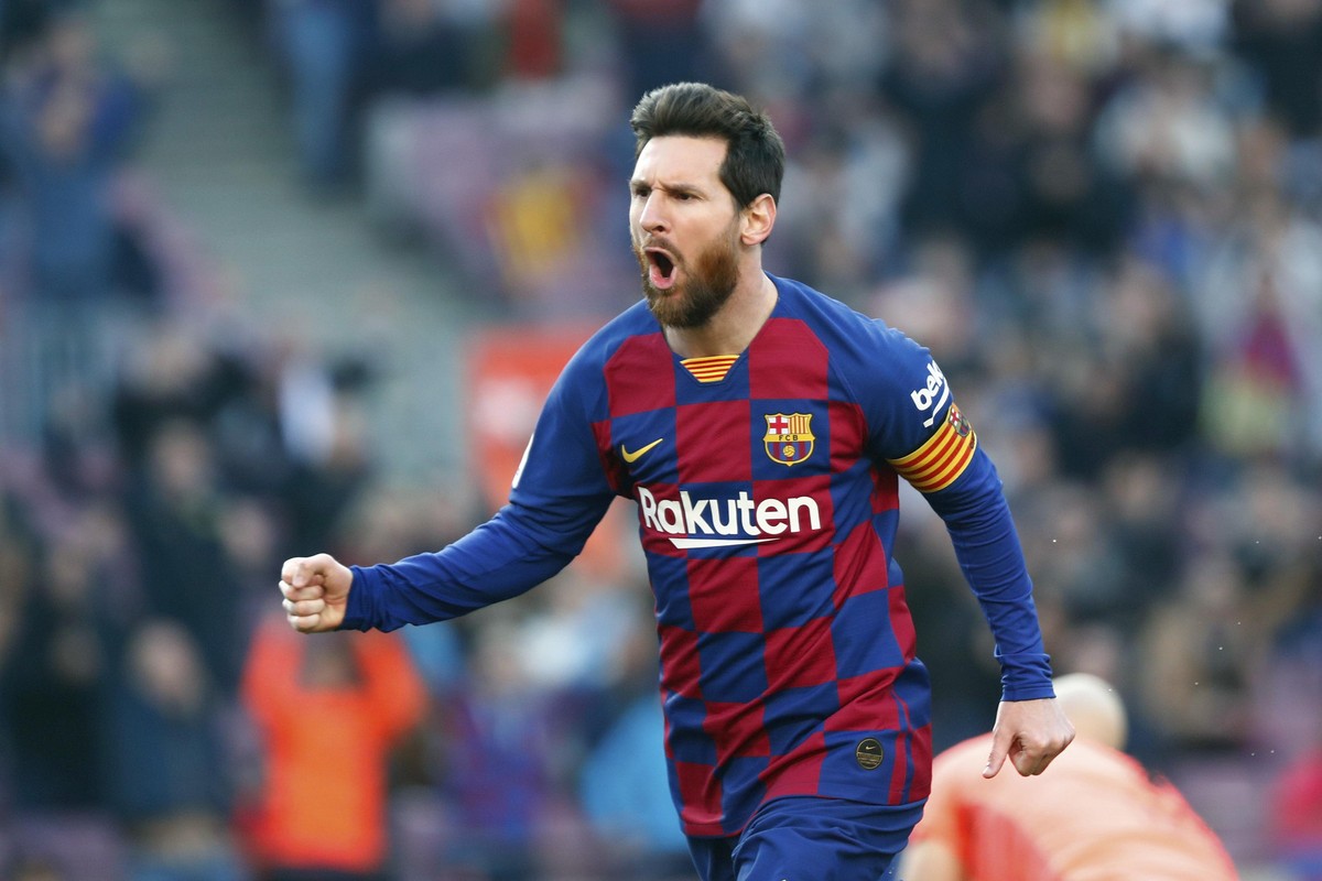 FILE - In this Saturday, Feb. 22, 2020 file photo, Barcelona's Lionel Messi celebrates after scoring his side's opening goal during a Spanish La Liga soccer match between Barcelona and Eibar ...