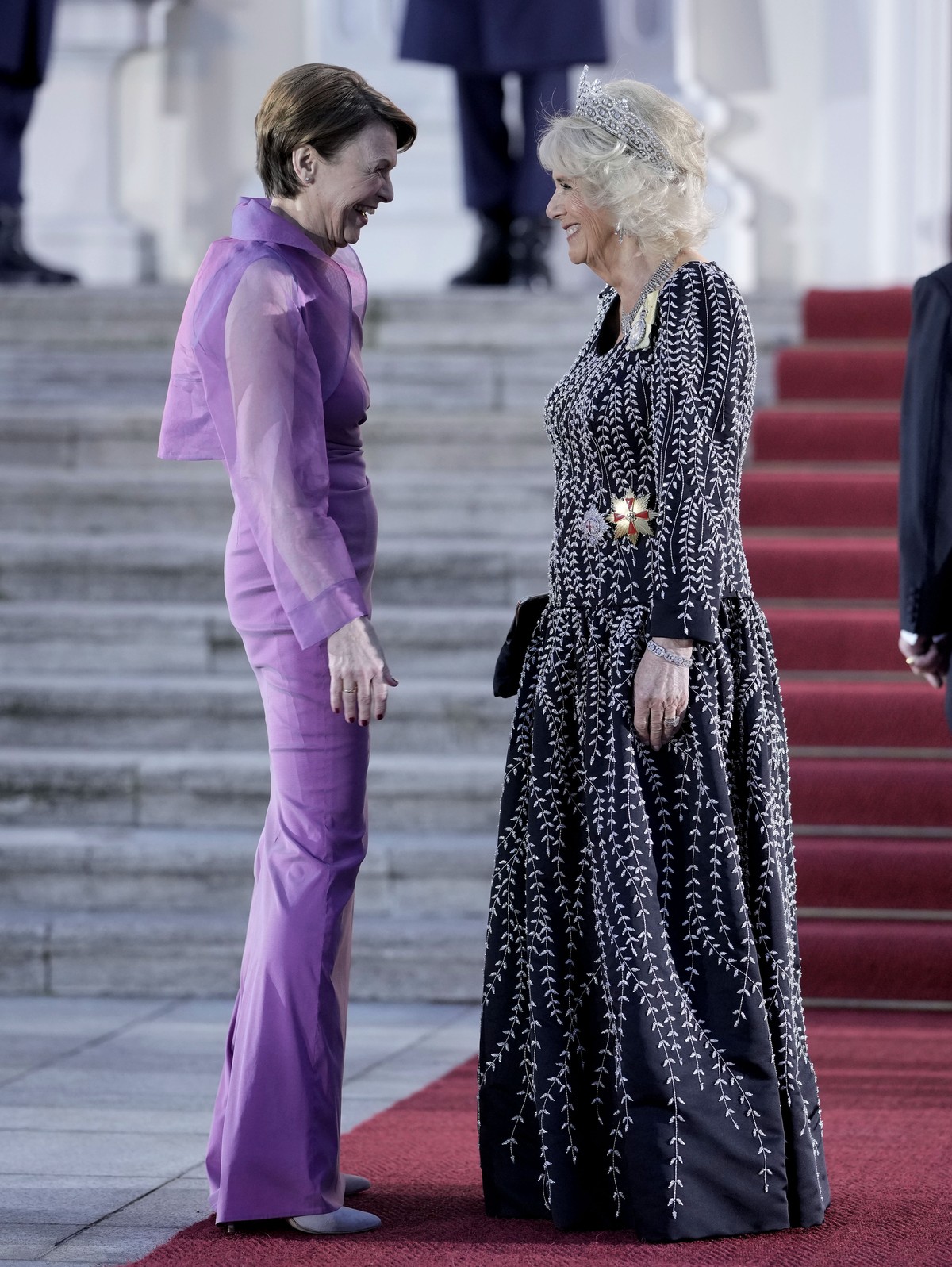 German President Frank-Walter Steinmeier's wife Elke Buedenbender, left, and Camilla, the Queen Consort, talk in front of the Bellevue Palace in Berlin, Wednesday, March 29, 2023. King Charles II ...