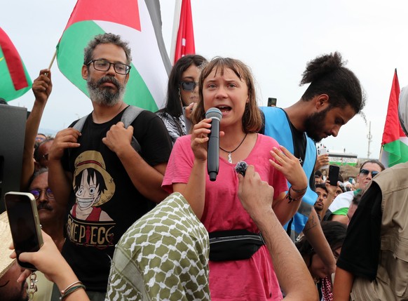 epa12361064 Swedish climate activist Greta Thunberg (C) participates in a demonstration of support for the Global Sumud Flotilla, which will arrive in the port of Sidi Bou Said, Tunisia, 07 September  ...