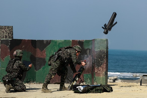 epa12689737 Taiwan navy personnel launch an attack drone during the Taiwan Military Combat Readiness Drill inside an naval base in Kaohsiung, Taiwan, 29 January 2026. Taiwan's Ministry of Nationa ...
