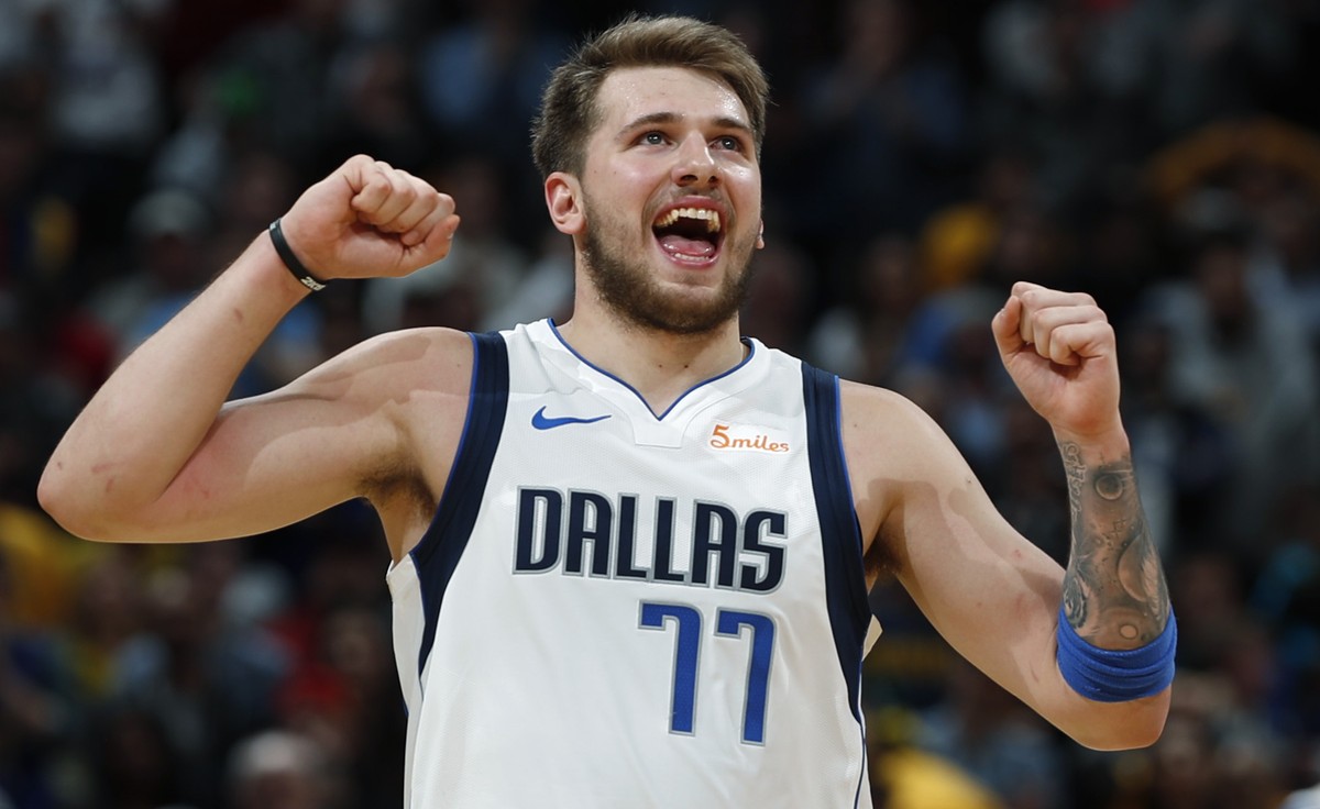 Dallas Mavericks forward Luka Doncic reacts after missing a foul shot late in the second half of the team's NBA basketball game against the Denver Nuggets on Thursday, March 14, 2019, in Denver.  ...