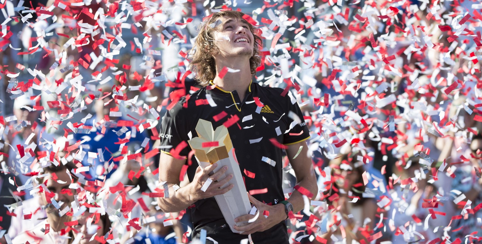 Confetti falls over Alexander Zverev, of Germany, during victory ceremonies after he defeated Roger Federer, of Switzerland, in the final at the Rogers Cup tennis tournament Sunday, Aug. 13, 2017, in  ...