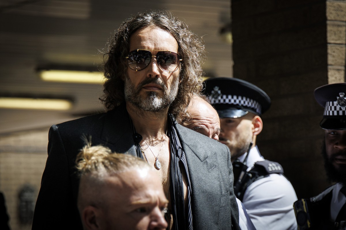 epa12144681 British comedian and actor Russell Brand leaves Southwark Crown Court after pleading not guilty to charges of rape, sexual assault, and indecent assault in London, Britain, 30 May 2025. EP ...