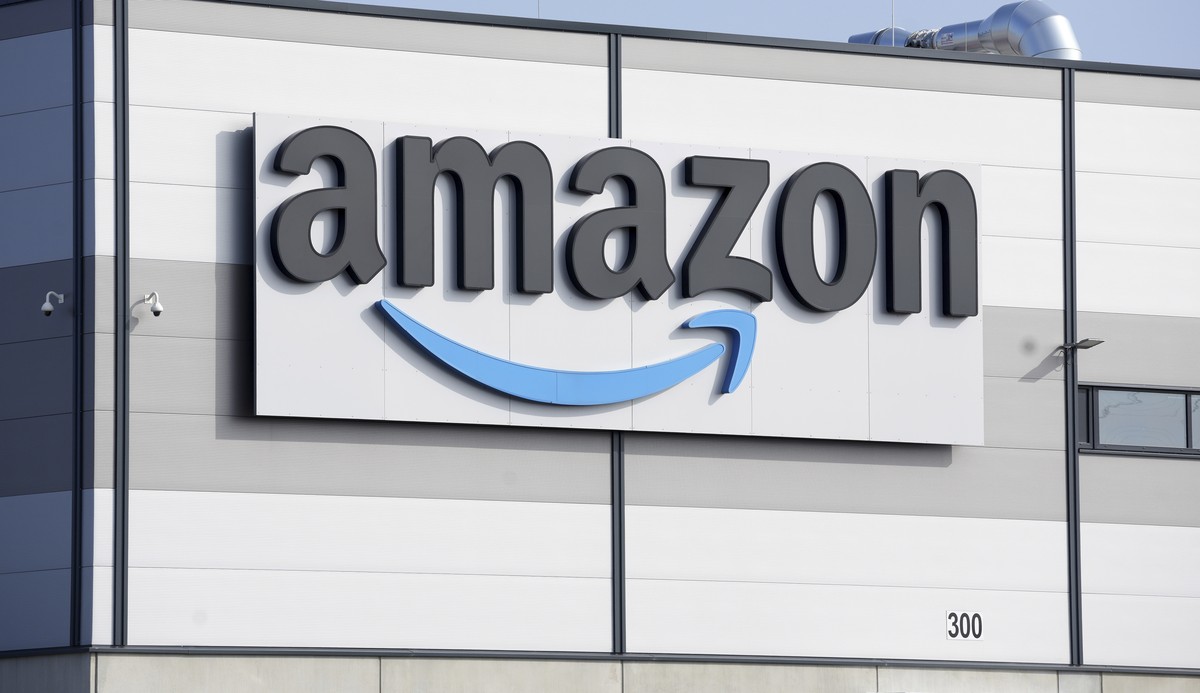 FILE - An Amazon company logo is seen on the facade of a company's building in Schoenefeld near Berlin, Germany, on March 18, 2022. Amazon has called off its proposed acquisition of iRobot, with  ...