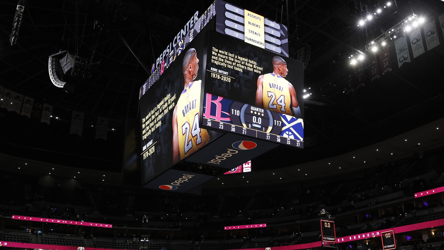 A tribute to Kobe Bryant illuminates the overhead scoreboard after the second half of an NBA basketball game Sunday, Jan. 26, 2020, in Denver. The Denver Nuggets won 117-110 over the Houston Rockets.  ...
