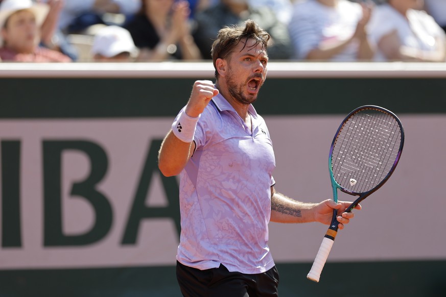 Switzerland&#039;s Stan Wawrinka clenches his fist after scoring a point against Australia&#039;s Thanasi Kokkinakis during their second round match of the French Open tennis tournament at the Roland ...