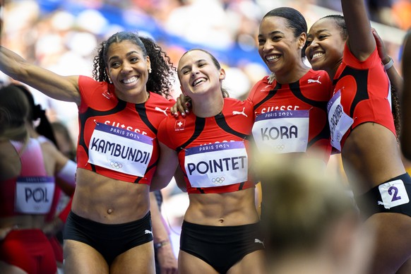 From left, Mujinga Kambundji, Leonie Pointet , Salome Kora and Sarah Atcho-Jaquier of Switzerland react after the women&#039;s 4 x 100m relay heats at the 2024 Paris Summer Olympics in Paris, France,  ...