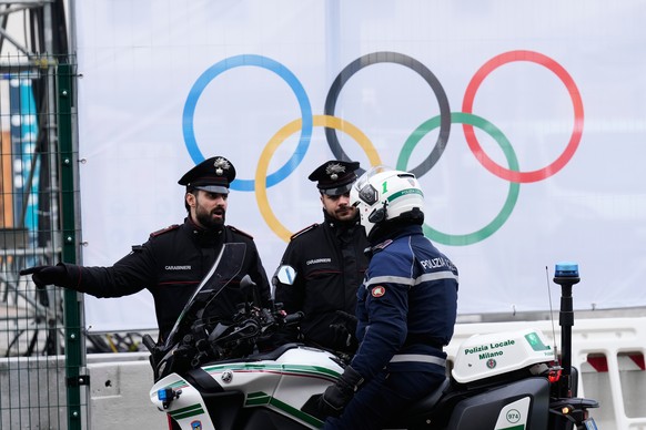 Italian police offers speak in front of the Olympic Village at the 2026 Winter Olympics, in Milan, Italy, Friday, Jan. 30, 2026. (AP Photo/Luca Bruno)
Milan Cortina Olympics