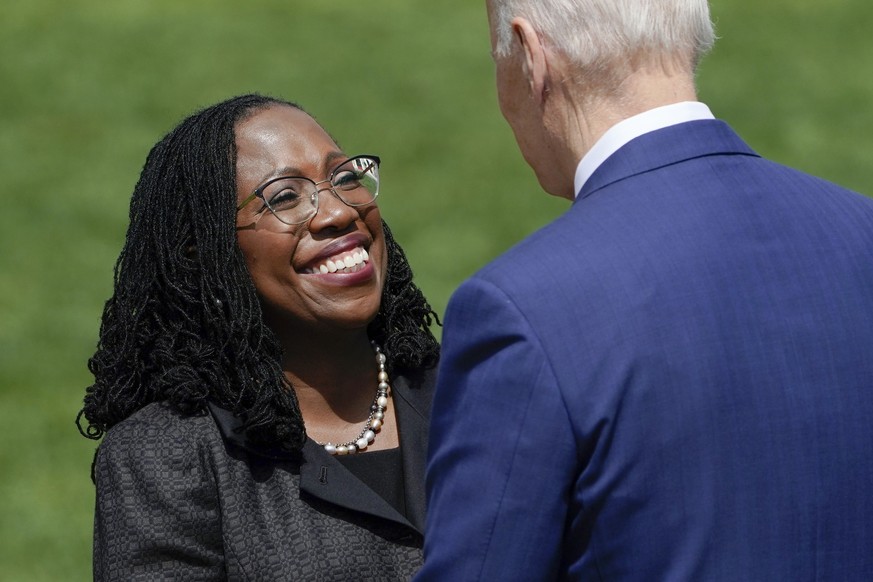 Judge Ketanji Brown Jackson shakes hands with President Joe Biden after he introduced her to speak at an event on the South Lawn of the White House in Washington, Friday, April 8, 2022, celebrating th ...