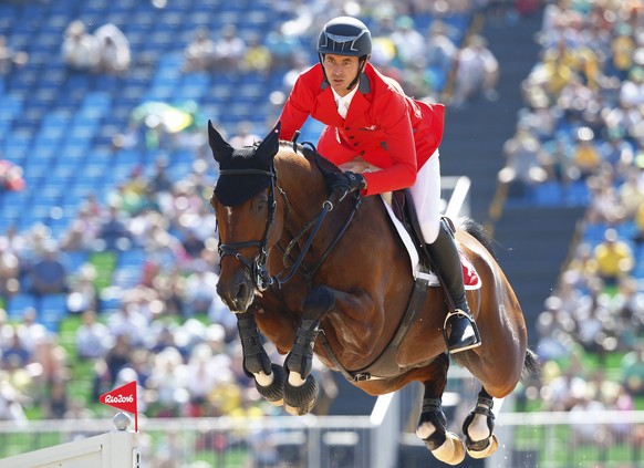 2016 Rio Olympics - Equestrian - Preliminary - Jumping Individual Qualification - Olympic Equestrian Centre - Rio de Janeiro, Brazil - 14/08/2016. Steve Guerdat (SUI) of Switzerland riding Nino Des Bu ...