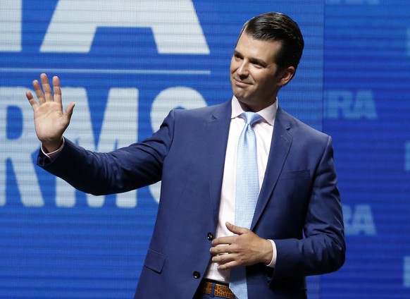 FILE - In this May 4, 2018, file photo, Donald Trump Jr., waves from the stage at the National Rifle Association in Dallas. (AP Photo/Sue Ogrocki, File)