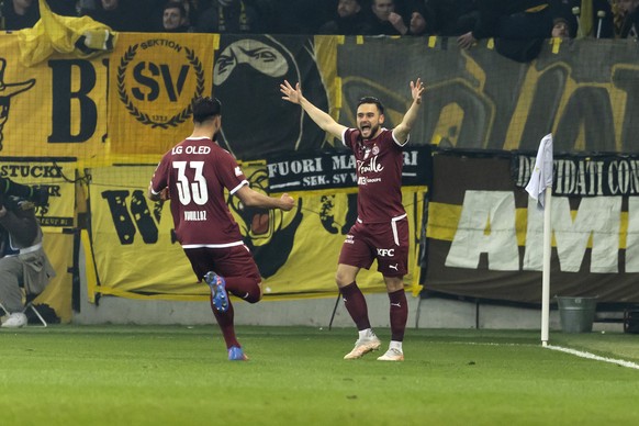 Servette&#039;s forward Alex Schalk, right, celebrates his goal past his teammate defender Nicolas Vouilloz, left, after scoring the 1:0, during the Super League soccer match of Swiss Championship bet ...