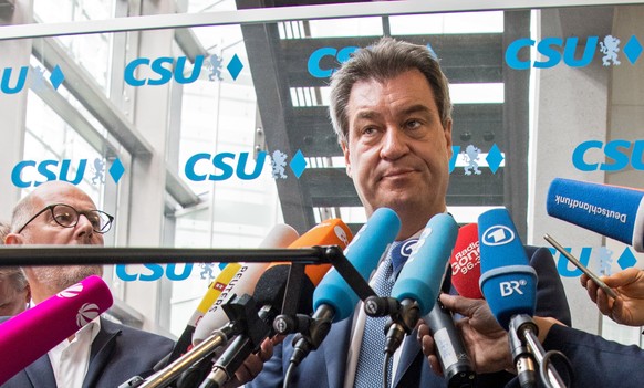 epa06817818 German state Bavaria's Prime Minister Markus Soeder gives a statement to the media at a Christian Social Union (CSU) party board meeting in Munich, Bavaria, Germany, 16 June 2018. The ...