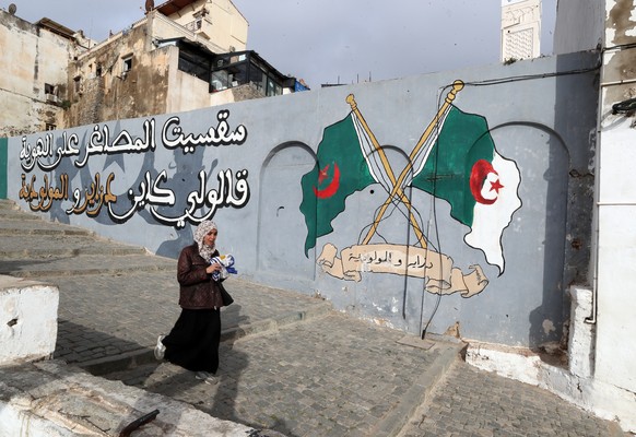 epa12022505 An Algerian woman walks on a street of the old town Casbah in Algiers, Algeria, 10 April 2025. Algerian Finance Minister Laziz Faid told the Finance and Budget Committee of the National Pe ...