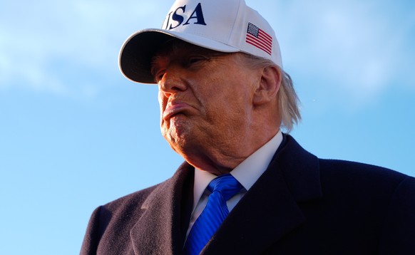 President Donald Trump speaks to reporters before he boards Air Force One, Friday, March 13, 2026, at Joint Base Andrews, Md., for a trip to Florida. (AP Photo/Mark Schiefelbein)
Donald Trump