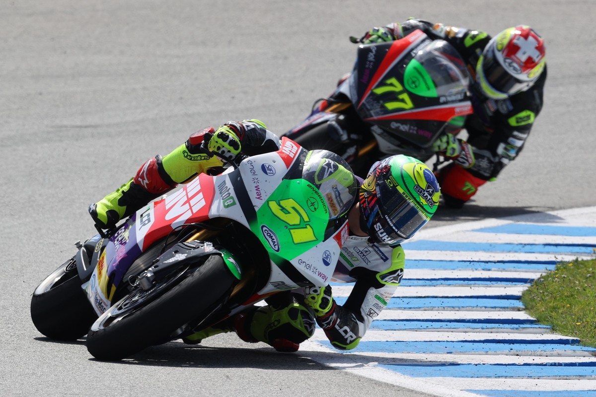 epa09918774 MotoE's Brazilian rider Eric Granado (LCR E-Team) (front) rides ahead of Swiss rider Dominique Aegerter (Dynavolt Intact GP MotoE) during their category's first race at 'Ang ...