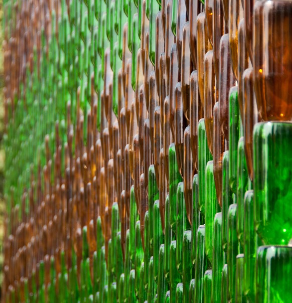 Detail of one of the walls of Wat Pa Maha Chedio Kaew, more commonly know as &quot;The Million Bottle Temple&quot; or &quot;Wat Lan Kuad&quot; in Thai. This Buddhist temple about 300 miles from Bangko ...