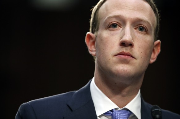FILE- In this April 10, 2018, file photo, Facebook CEO Mark Zuckerberg testifies before a joint hearing of the Commerce and Judiciary Committees on Capitol Hill in Washington. Last spring, as false cl ...