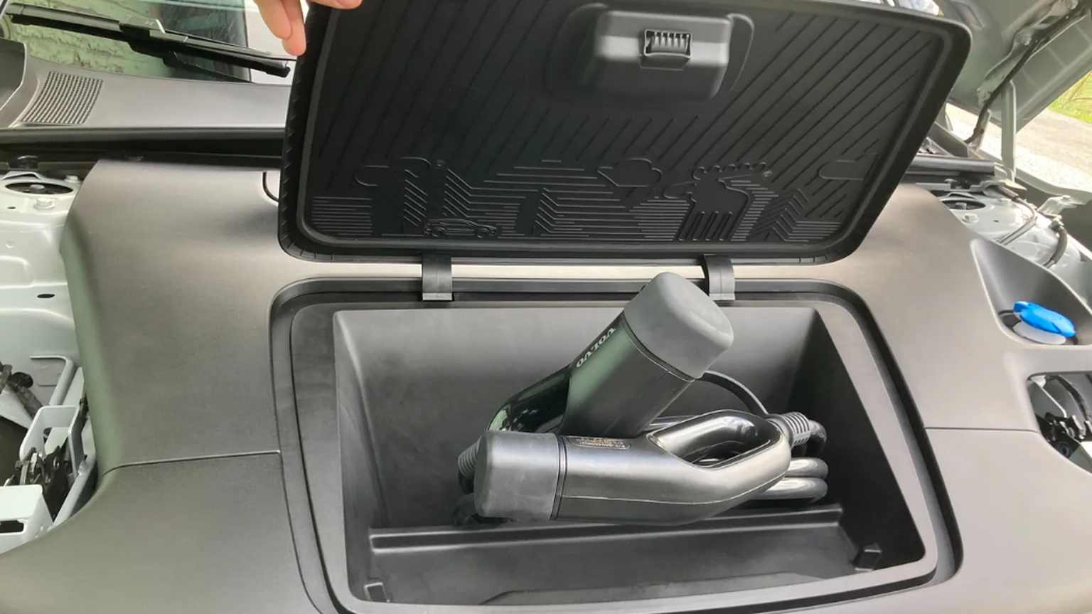 The cute moose in the plastic flap offers no relief: the frunk under the front cover is too small for thick charging cables.