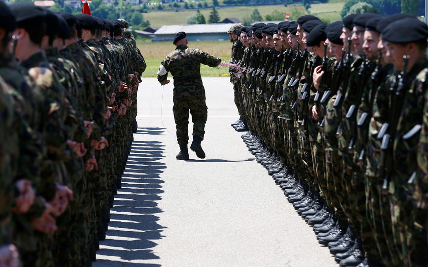 A Swiss Army staff prepares the guard of honour for Swiss President Johann Schneider-Ammann and Georgian Prime Minister Giorgi Kvirikashvili (not pictured) at the Bern Airport in Belp, Switzerland Jun ...