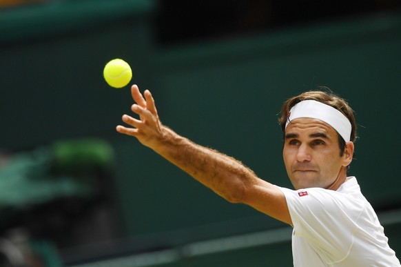 epa06875546 Roger Federer of Switzerland serves to Adrian Mannarino of France during their fourth round match against at the Wimbledon Championships at the All England Lawn Tennis Club, in London, Bri ...